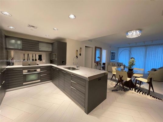 Chandelier, Dining room, Interior, Kitchen, Recessed Lighting, Stainless Steel Appliances, Wood Texture Flooring