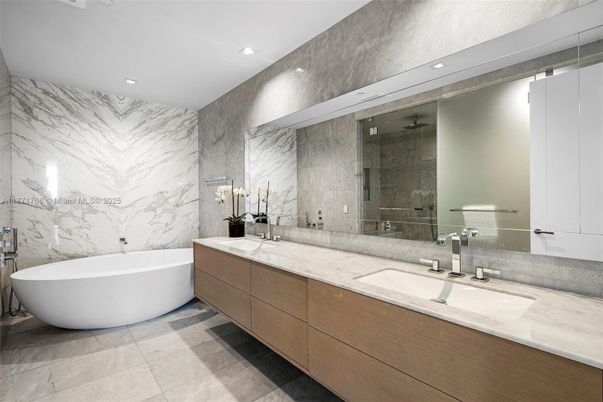 Bathroom, Dual Sink Vanities, Free Standing Baths, Glass Shower, Interior, Marble Walls, Recessed Lighting
