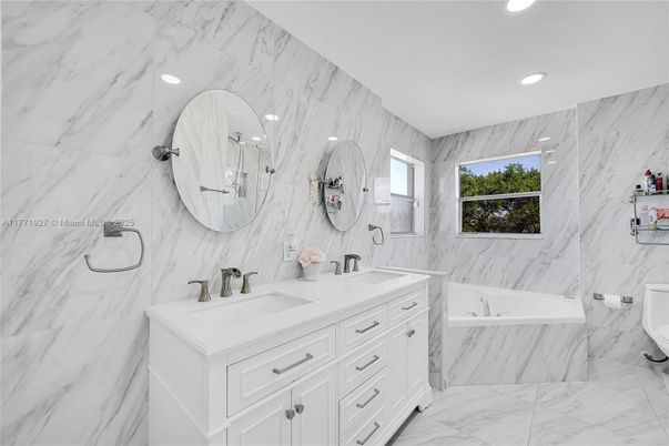 Bathroom, Dual Sink Vanities, Interior, Marble, Marble Walls, Recessed Lighting