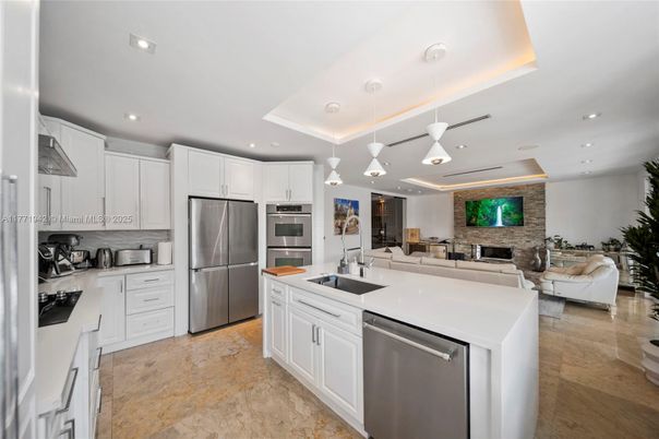 Fireplace, Interior, Kitchen, Living room, Pendant Lights, Recessed Lighting, Stainless Steel Appliances, Stone Walls