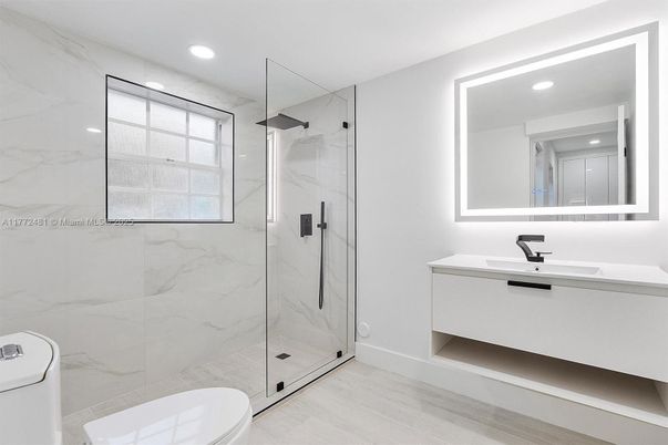 Bathroom, Glass Shower, Interior, Marble Walls, Recessed Lighting, Wood Texture Flooring