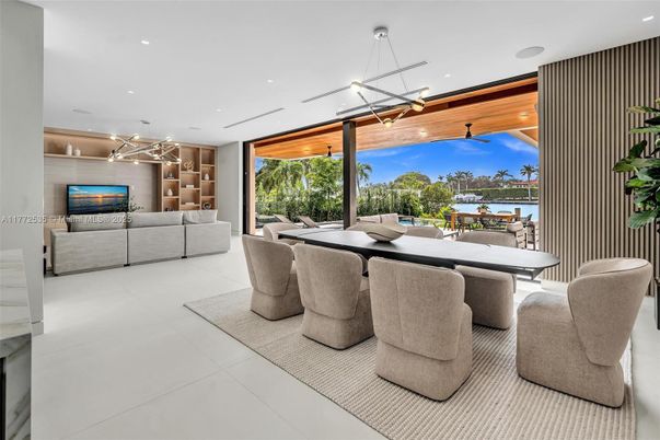 Dining room, Fireplace, Interior, Living room, Pendant Lights, Recessed Lighting, Water, Wooden Ceilings