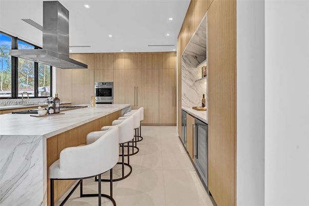 Interior, Kitchen, Marble Walls, Recessed Lighting, Stainless Steel Appliances