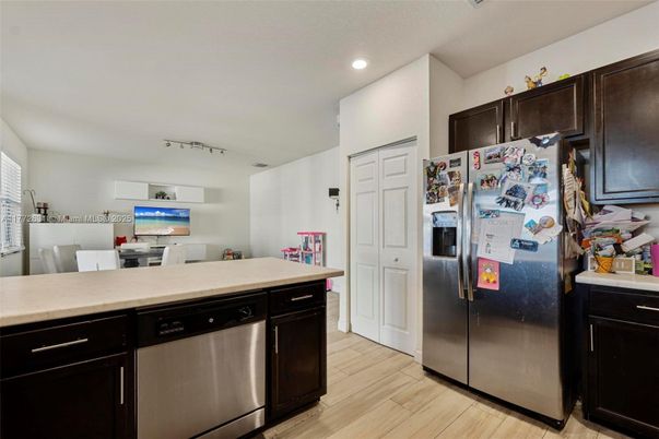 Dining room, Interior, Kitchen, Recessed Lighting, Stainless Steel Appliances, Wood Texture Flooring
