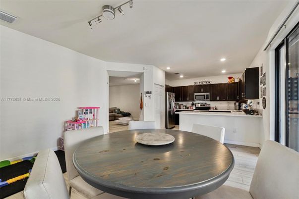 Dining room, Interior, Kitchen, Recessed Lighting, Stainless Steel Appliances, Wood Texture Flooring