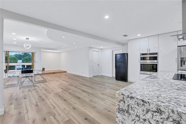 Dining room, Interior, Kitchen, Pendant Lights, Recessed Lighting, Stainless Steel Appliances, Wood Texture Flooring