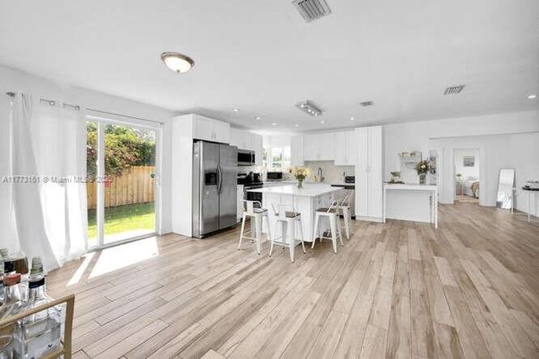 Dining room, Interior, Kitchen, Recessed Lighting, Stainless Steel Appliances, Wood Texture Flooring