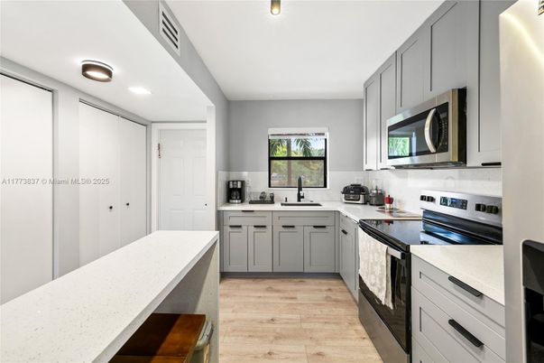 Interior, Kitchen, Recessed Lighting, Stainless Steel Appliances, Wood Texture Flooring