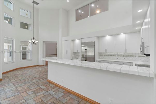 Interior, Kitchen, Pendant Lights, Recessed Lighting, Stainless Steel Appliances, Tile Countertops