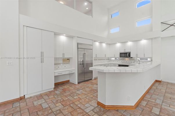 Interior, Kitchen, Recessed Lighting, Stainless Steel Appliances, Tile Countertops