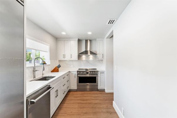 Interior, Kitchen, Recessed Lighting, Stainless Steel Appliances, Wood Texture Flooring