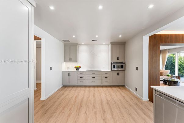 Interior, Kitchen, Marble Walls, Recessed Lighting, Stainless Steel Appliances, Wood Texture Flooring