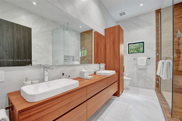Bathroom, Dual Sink Vanities, Glass Shower, Interior, Marble, Marble Walls, Recessed Lighting