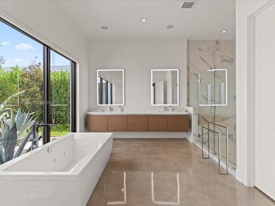 Bathroom, Dual Sink Vanities, Free Standing Baths, Glass Shower, Interior, Marble Walls, Recessed Lighting
