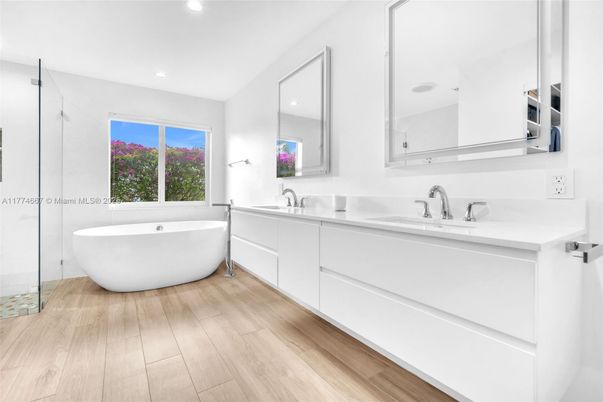 Bathroom, Dual Sink Vanities, Free Standing Baths, Interior, Recessed Lighting, Wood Texture Flooring