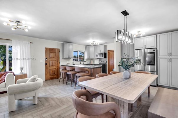 Chandelier, Dining room, Interior, Kitchen, Pendant Lights, Stainless Steel Appliances, Wood Texture Flooring