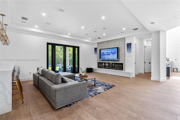 Fireplace, Interior, Living room, Recessed Lighting, Stone Walls, Wood Texture Flooring