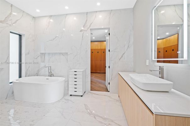 Bathroom, Dual Sink Vanities, Free Standing Baths, Interior, Marble, Marble Walls, Recessed Lighting