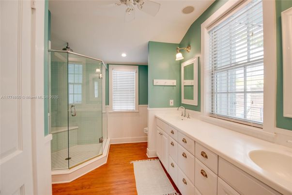 Bathroom, Dual Sink Vanities, Glass Shower, Interior, Recessed Lighting, Wood Texture Flooring
