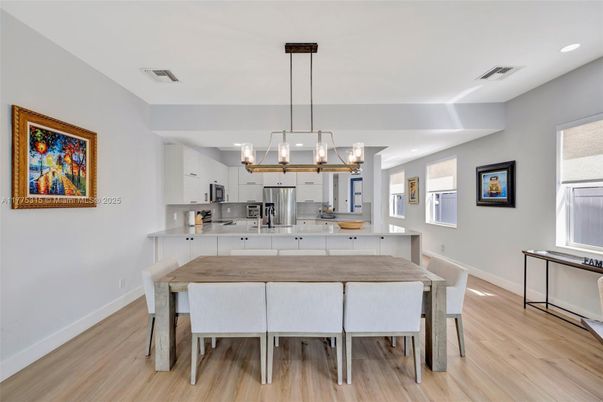 Dining room, Interior, Kitchen, Pendant Lights, Recessed Lighting, Stainless Steel Appliances, Wood Texture Flooring