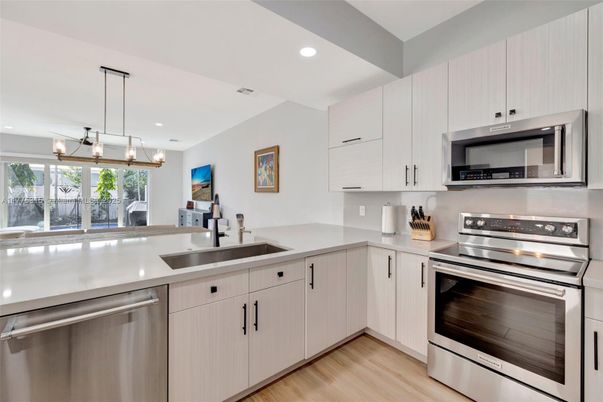 Interior, Kitchen, Pendant Lights, Recessed Lighting, Stainless Steel Appliances, Wood Texture Flooring