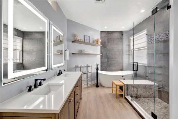 Bathroom, Dual Sink Vanities, Free Standing Baths, Glass Shower, Interior, Recessed Lighting, Wood Texture Flooring