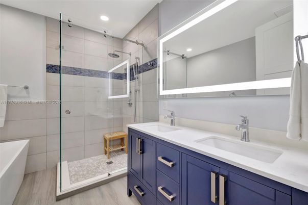 Bathroom, Dual Sink Vanities, Glass Shower, Interior, Recessed Lighting, Wood Texture Flooring