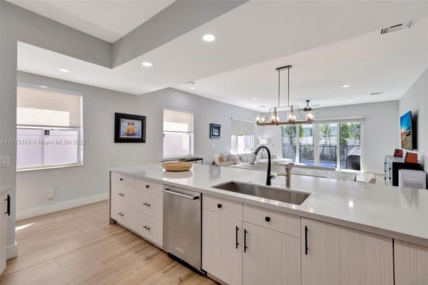 Chandelier, Interior, Kitchen, Pendant Lights, Recessed Lighting, Stainless Steel Appliances, Wood Texture Flooring