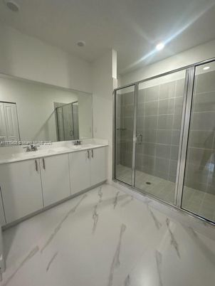 Bathroom, Dual Sink Vanities, Glass Shower, Interior, Marble, Recessed Lighting