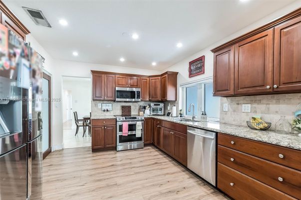 Interior, Kitchen, Recessed Lighting, Stainless Steel Appliances, Wood Texture Flooring
