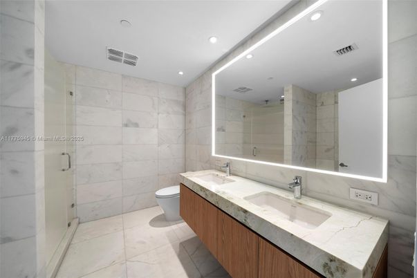 Bathroom, Dual Sink Vanities, Glass Shower, Interior, Marble Walls, Recessed Lighting