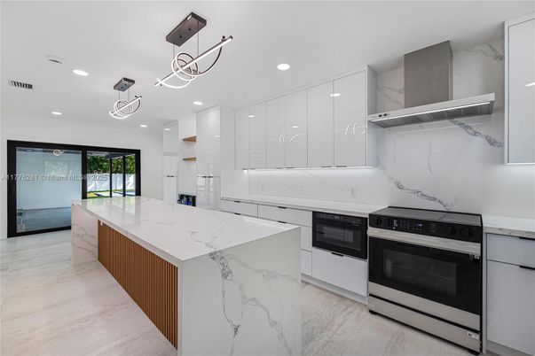 Interior, Kitchen, Marble, Marble Walls, Pendant Lights, Recessed Lighting, Stainless Steel Appliances