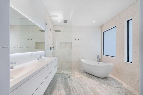 Bathroom, Dual Sink Vanities, Free Standing Baths, Glass Shower, Interior, Recessed Lighting, Wood Texture Flooring