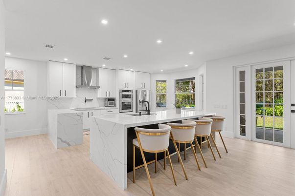 Interior, Kitchen, Marble Walls, Recessed Lighting, Stainless Steel Appliances, Wood Texture Flooring