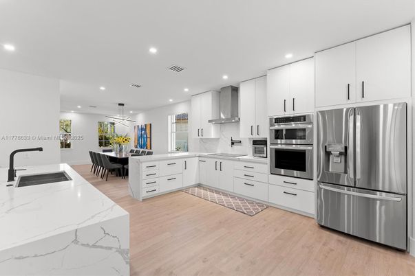 Dining room, Interior, Kitchen, Pendant Lights, Recessed Lighting, Stainless Steel Appliances, Wood Texture Flooring