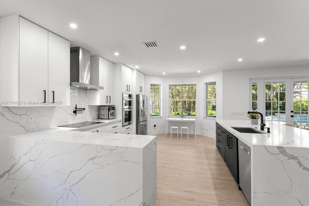 Interior, Kitchen, Marble Walls, Recessed Lighting, Stainless Steel Appliances, Wood Texture Flooring