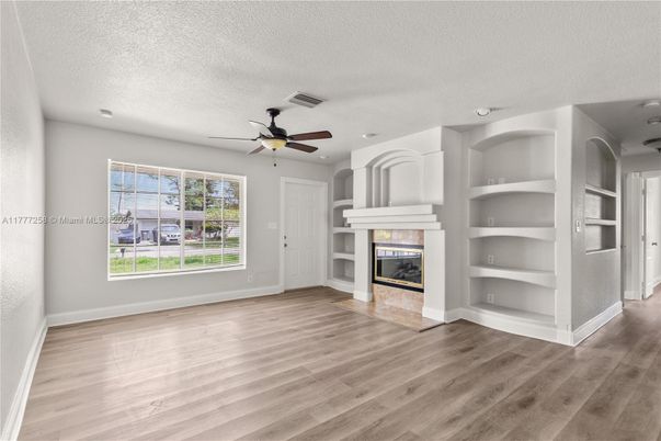 Empty room, Fireplace, Interior, Recessed Lighting, Wood Texture Flooring