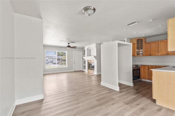 Fireplace, Interior, Kitchen, Recessed Lighting, Wood Texture Flooring