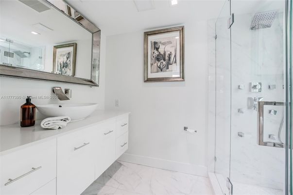 Bathroom, Dual Sink Vanities, Glass Shower, Interior, Marble, Marble Walls, Recessed Lighting