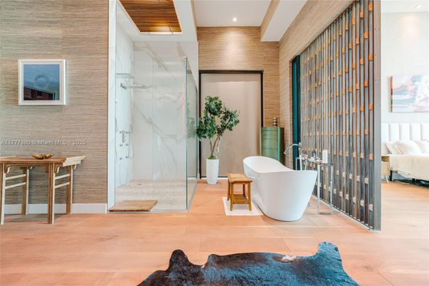 Bathroom, Free Standing Baths, Glass Shower, Interior, Marble Walls, Recessed Lighting, Wood Texture Flooring