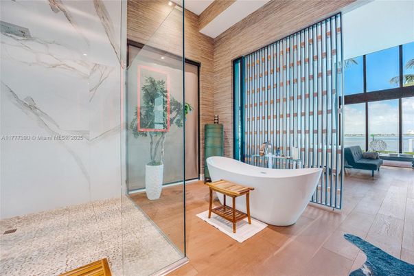 Bathroom, Free Standing Baths, Glass Shower, Interior, Marble Walls, Recessed Lighting, Wood Texture Flooring