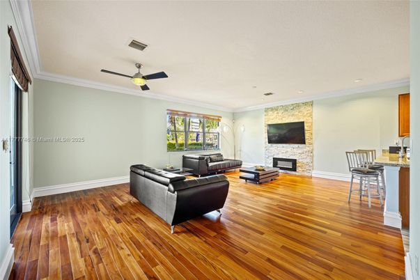 Fireplace, Interior, Living room, Recessed Lighting, Stone Walls, Wood Texture Flooring