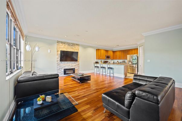 Fireplace, Interior, Kitchen, Living room, Recessed Lighting, Stainless Steel Appliances, Stone Walls, Wood Texture Flooring