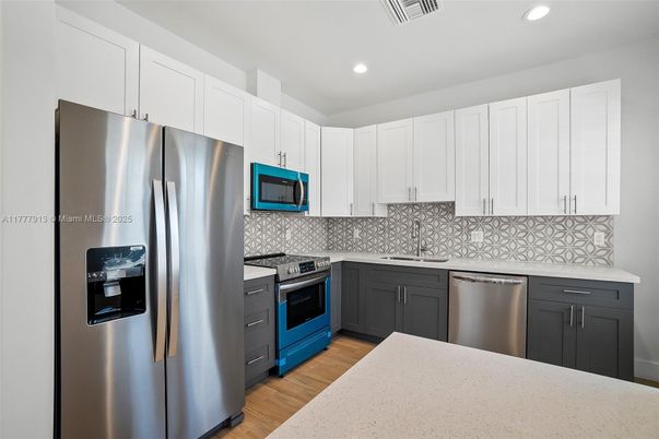 Interior, Kitchen, Recessed Lighting, Stainless Steel Appliances, Wood Texture Flooring