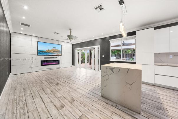 Fireplace, Interior, Kitchen, Marble Walls, Pendant Lights, Recessed Lighting, Wood Texture Flooring
