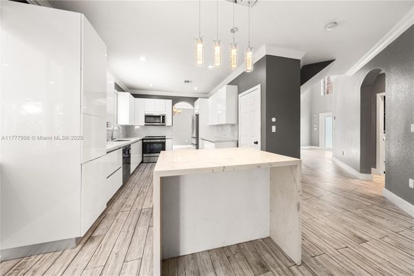 Interior, Kitchen, Pendant Lights, Recessed Lighting, Stainless Steel Appliances, Wood Texture Flooring