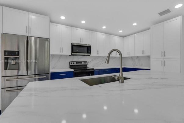 Interior, Kitchen, Marble, Marble Walls, Recessed Lighting, Stainless Steel Appliances