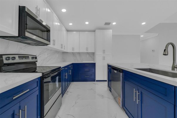Interior, Kitchen, Marble, Marble Walls, Recessed Lighting, Stainless Steel Appliances