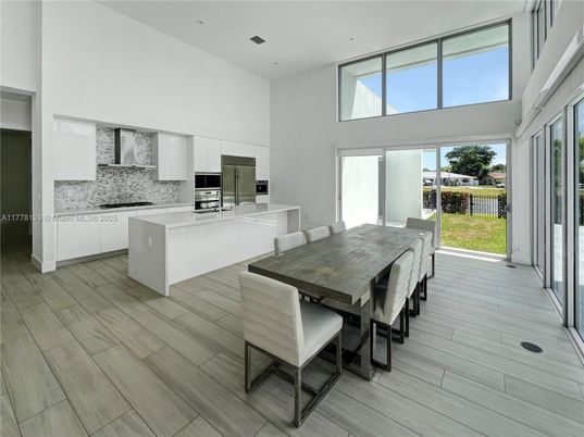 Dining room, Interior, Kitchen, Recessed Lighting, Stainless Steel Appliances, Wood Texture Flooring