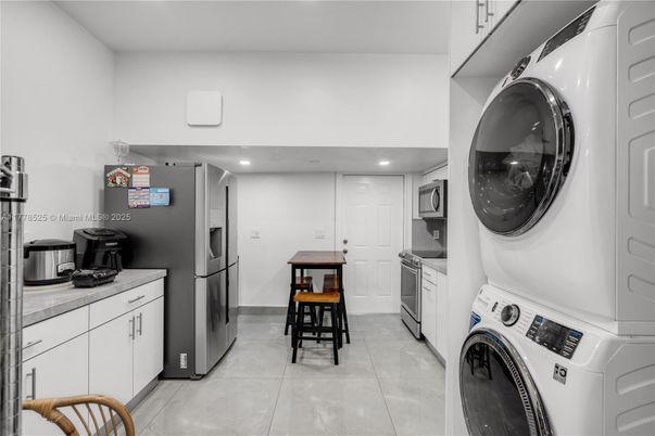 Interior, Kitchen, Recessed Lighting, Tile Countertops, Washer